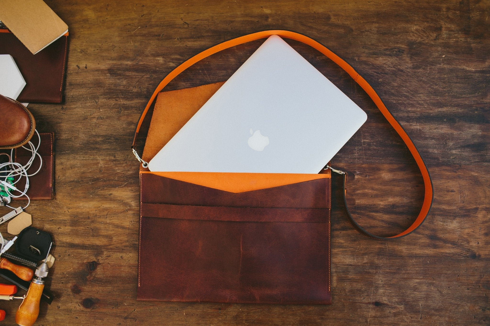 brown leather macbook sleeve, with shoulder strap, front side